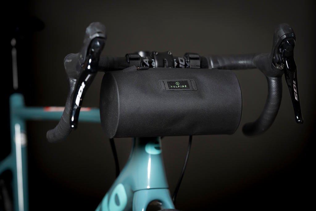 Black Vulpine Finnieston Canister Bag mounted on road bike handlebars