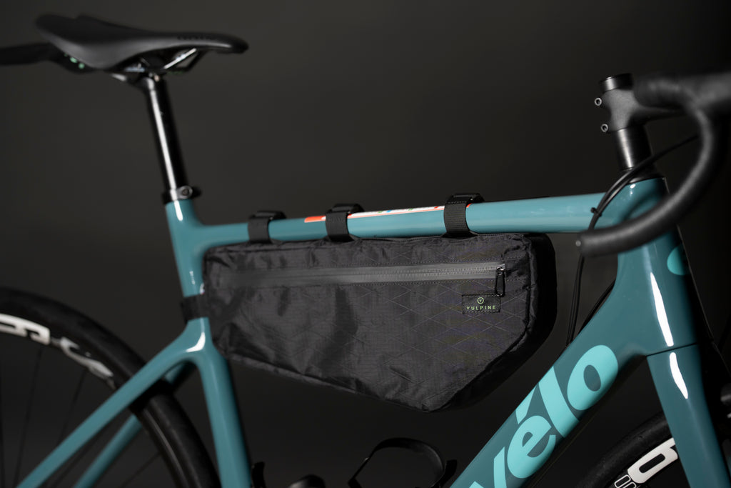 Black Vulpine Finnieston Frame Bag mounted inside a teal road bike frame