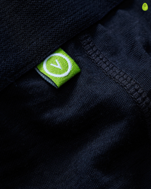 Close-up of a vulpine logo on a dark fabric background